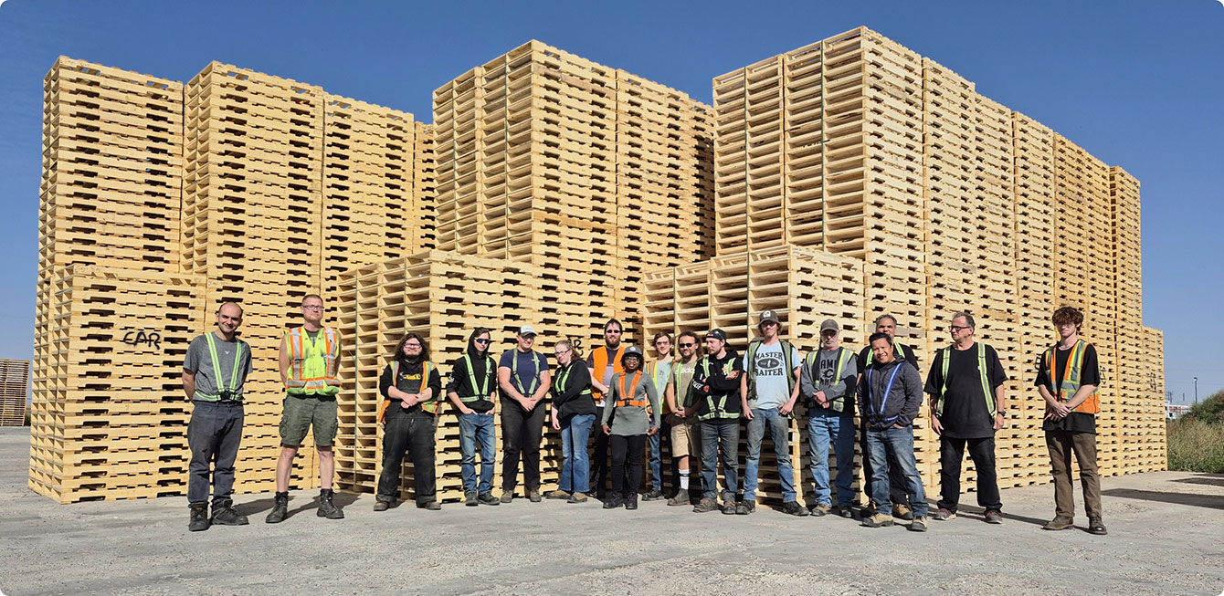 Team standing infront of pellets